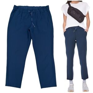 Lululemon On The Fly Pant Womens Sz 12 Navy 27” Inseam Drawstring Woven Travel